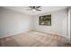 Bright bedroom with natural light, carpet, and a modern ceiling fan, creating a welcoming space at 8092 Ponderosa Ln, Parker, CO 80138