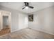 Inviting bedroom featuring a closet, carpeting, and a modern ceiling fan at 8092 Ponderosa Ln, Parker, CO 80138