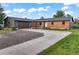 Charming single-story brick home with attached garage, long drive and welcoming curb appeal at 8092 Ponderosa Ln, Parker, CO 80138