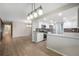 Open-concept kitchen includes stainless steel appliances, gray subway tile backsplash, and light countertops at 8092 Ponderosa Ln, Parker, CO 80138