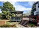 Backyard wooden deck with a covered dining area, perfect for enjoying meals outdoors at 879 E 133Rd Ave, Thornton, CO 80241