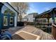 Inviting backyard with a wooden deck, outdoor grill, and covered seating area, perfect for entertaining guests at 879 E 133Rd Ave, Thornton, CO 80241