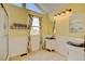 Bright bathroom with vessel sinks, decorative mirrors, and floral curtains at 879 E 133Rd Ave, Thornton, CO 80241