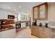 Bright kitchen features recessed lighting, wood floors, granite counters and a large window bringing in ample natural light at 879 E 133Rd Ave, Thornton, CO 80241