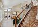 Spacious living room with vaulted ceilings, hardwood floors, a staircase and views of the dining area and kitchen at 879 E 133Rd Ave, Thornton, CO 80241
