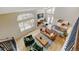 Open-concept living space with vaulted ceilings, hardwood floors, and views to the kitchen and dining area at 879 E 133Rd Ave, Thornton, CO 80241