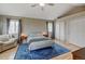 Bright main bedroom features vaulted ceilings, seating area, and plush rug at 879 E 133Rd Ave, Thornton, CO 80241