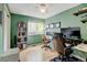 Inviting home office with built-in shelves, desk, and natural light at 879 E 133Rd Ave, Thornton, CO 80241