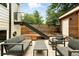 Backyard with outdoor seating, patio, and a staircase leading to an upper level at 4129 Zenobia St, Denver, CO 80212