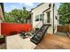 Backyard with outdoor seating, stairs, wood deck, and privacy fence at 4129 Zenobia St, Denver, CO 80212