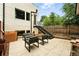 Backyard with outdoor seating, patio, and a staircase leading to an upper level at 4129 Zenobia St, Denver, CO 80212