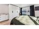 Bedroom featuring a bed, large closet, and a balcony at 4129 Zenobia St, Denver, CO 80212