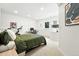 Bedroom features neutral decor, an exercise bike, and dedicated office space for work or hobbies at 4129 Zenobia St, Denver, CO 80212