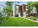 Contemporary two-story home with a green lawn and landscaping at 4129 Zenobia St, Denver, CO 80212
