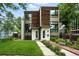 Modern exterior showcasing a well-maintained lawn, walkway, and landscaped garden beds enhancing curb appeal at 4129 Zenobia St, Denver, CO 80212