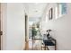 Hallway with wood floors, modern lighting, and natural light through windows at 4129 Zenobia St, Denver, CO 80212