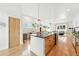 Spacious kitchen with center island, modern appliances, and hardwood floors at 4129 Zenobia St, Denver, CO 80212