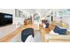 Bright living room with wood floors, a stylish leather sofa, and an open concept layout perfect for entertaining at 4129 Zenobia St, Denver, CO 80212