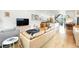 Cozy living area with a comfortable sofa, hardwood floors, and an open floor plan connecting to the kitchen at 4129 Zenobia St, Denver, CO 80212