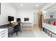 Spacious office with neutral colors and bookshelf at 4129 Zenobia St, Denver, CO 80212