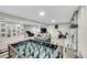 Recreational room features a foosball table, TV, stone fireplace and comfortable seating arrangement at 860 Waite Dr, Boulder, CO 80303