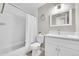 Bright bathroom features a tub/shower combo, white vanity, and neutral wall color at 860 Waite Dr, Boulder, CO 80303