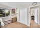 Bright bedroom with hardwood floors, closet, and natural light from a large window at 860 Waite Dr, Boulder, CO 80303