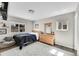 Cozy bedroom featuring light wood floors and a large area rug at 860 Waite Dr, Boulder, CO 80303