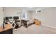 Carpeted room with two desks, monitors, and natural light at 860 Waite Dr, Boulder, CO 80303