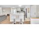 Stylish kitchen with white cabinets, stainless steel appliances, and island seating perfect for entertaining at 860 Waite Dr, Boulder, CO 80303