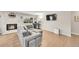 Comfortable living room with hardwood floors, gray sofa, and a mounted television at 860 Waite Dr, Boulder, CO 80303
