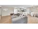 Spacious living room featuring hardwood floors and access to the kitchen and dining areas at 860 Waite Dr, Boulder, CO 80303
