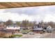 Scenic neighborhood view with surrounding houses, lush trees, and distant mountain peaks at 4303 Osceola St, Denver, CO 80212