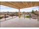 A balcony overlooking a residential neighborhood, with wood ceiling and metal guard rails at 4303 Osceola St, Denver, CO 80212