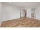 The bedroom boasts hardwood floors with view into the bathroom and hallway at 4303 Osceola St, Denver, CO 80212