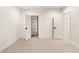 Bright bedroom featuring neutral carpet and several doors including closet at 4303 Osceola St, Denver, CO 80212