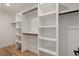 This walk-in closet features built-in shelving and plenty of hanging space at 4303 Osceola St, Denver, CO 80212