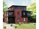 Modern two-story home with red brick and gray siding, complemented by lush landscaping and a stone walkway at 4303 Osceola St, Denver, CO 80212