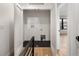 Laundry room with hookups and modern black tile floors, adjoins a bright bedroom at 4303 Osceola St, Denver, CO 80212