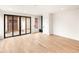 Open-concept living area with sliding glass doors and modern finishes at 4303 Osceola St, Denver, CO 80212