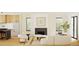 Cozy living room with a fireplace, neutral furnishings, and natural light at 4303 Osceola St, Denver, CO 80212