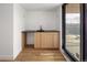 Mud room featuring a sink with modern wood cabinets, and a large window for ample natural light at 4303 Osceola St, Denver, CO 80212