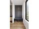 Mud room features built in gray bench and storage with access to the bathroom at 4303 Osceola St, Denver, CO 80212