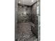 This features a new marble-tiled shower with a glass door and matte black fixtures at 4303 Osceola St, Denver, CO 80212