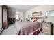 Cozy bedroom with a sitting area, plush carpet, and a comfortable bed, ideal for relaxation and rest at 715 Main St, Georgetown, CO 80444