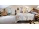 Spacious bedroom with light-colored carpet, a comfortable bed, and natural light from the windows, creating a serene atmosphere at 715 Main St, Georgetown, CO 80444