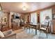 Charming dining room featuring a wooden table and chairs, ample natural light, and vintage touches at 715 Main St, Georgetown, CO 80444