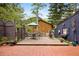 A spacious brick patio with outdoor seating area and mountain views, perfect for relaxing and entertaining at 715 Main St, Georgetown, CO 80444