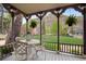 Inviting porch with mountain views, wrought iron table and chairs, and hanging plants at 715 Main St, Georgetown, CO 80444