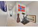 Hallway with carpet flooring, exercise bike, and guitar case at 9355 Gore St # C, Arvada, CO 80007